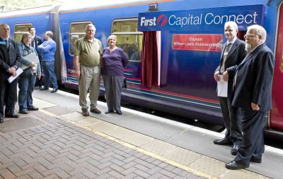 Gordon Hill centenary train naming event
To mark the 100th anniversary of the extension of the GN route from Enfield Chase to Cuffley, First Capital Connect named a Class 313 train in honour of Captain William Leefe Robinson in recognition of his part of the area’s history, when he shot down a German airship over Cuffley during the First World War in 1916.
 
     Standing to the left of the train name (left to right) - Mr Jordan & Mrs Elizabeth Robinson Scott Jordan. Mrs Jordan is a descendant of Leefe Robinson.
 
     Standing to the right of the train name (left to right) - Neal Lawson - Managing Director First Capital Connect and Rufus Barnes, former Chief Executive of London Travel Watch and a Gordon Hill commuter.
Keywords: GNR centenary