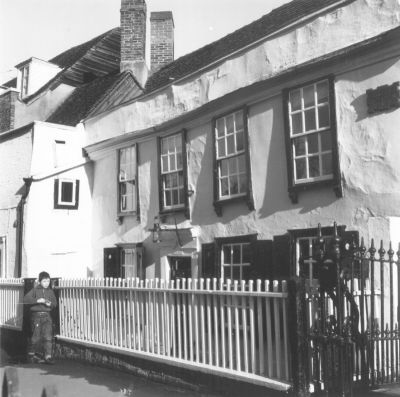 Clarendon Cottage, 17 Gentleman's Row
Originally a 16th century timber-framed hall house of two bays, an extension was added in the 17th century when the whole was refronted and covered in painted stucco. The sash windows, those on the ground floor with external shutters, are 18th century, but the bull's-eye window (not visible in this image) is a modern addition. The door of six fielded panels, now top-glazed, sits in a raised stucco surround with Gothic raised border and break-front doorcase. A picturesque cottage much favoured by local artists, a wooden plaque notes its association with Charles and Mary Lamb, who stayed for some months on two occasions (1825 and 1827) when it was a boarding house. - [From [i]Treasures of Enfield[/i]]

By the end of the 17th century it had become, as was the fate of so many houses in Gentleman's Row, a girls' school. - [From [i]A portrait of Gentleman's Row[/i]]
Keywords: Gentlemans Row;residential houses;schools;16th century;Grade II* listed;