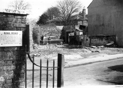 Demolition of cottages in Church Lane
Demolished by Enfield council in anticipation of the construction of a ring road. The EPS campaign notice reads: "RING ROAD. This is where the proposed ring road will run. If you wish to preserve these quiet walks and the beauty of this place, get in touch with the petition organiser: ..."
Keywords: roads and streets;footpaths;demolished buildings;campaigns;LC5