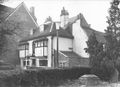 Uvedale House, Church Walk
Early 16th century. Listed Grade II. Originally Tudor but much altered externally. It was 're-Tudorised' in the 20th century, obiterating the simple but pretty brick Georgian facade shown in an old photograph. Two storeys and attick with dormers, painted white brick work and half-timbering; the square oriel windows on the first floor and wide casements below are modern. - [i]Treasures of Enfield[/i], p. 86.
Keywords: 16th century;Grade II listed;historic houses;half-timbering