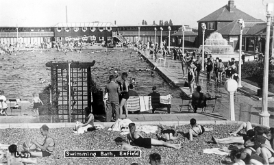 Swimming pool, Southbury Road
An undated postcard. When this pool opened in 1932 it was advertised in a contemporary borchure as "the largest open-air baths in the London area ... with room for 1,000 bathers at any one time. ... At each end of the swimming bath there is a sun-bathing beach, approximately forty feet by eighty feet, the shingle for which was obtained from Folkestone beach." - [i]Fighting for the future[/i], p. 259.
Keywords: 1930s;sport;swimming pools