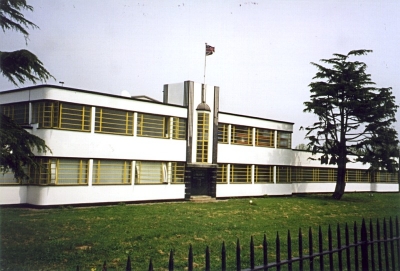 MAN depot, former Ripaults factory
Listed Grade II. Built in about 1930 by A. H. Durnford. A rare surviving example of stuccoed, flat roof Art Deco "decorated shed" with characteristic horizontal strip windows curving into the returns. - [i]Treasures of Enfield[/i], p.31. 
Originally Ripaults factory for the manufacture of automotive electrical cables and components, it was later a depot for the truck manufacturer MAN (Maschinenfabrik Augsburg-Nürnberg). It is currently empty and has suffered from graffiti and vandalism.
Keywords: 1930s;factories;industry;Grade II listed