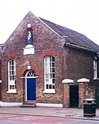 Charity School, Church Street, Edmonton
Single storey building, with a central arched doorway to the street and sash windows to either side. Above the doorway is a statuette of a female pupil. The condition of the building is slowly deteriorating and the former use is unable to provide adequate income for its upkeep. An Historic England funded Conservation Management Plan, condition survey and options appraisal have been produced. Discussions have begun with potential new users. - [URL=https://historicengland.org.uk/advice/heritage-at-risk/search-register/list-entry/1255213]Historic England Heritage at Risk Register[/URL]
Keywords: listed buildings;sculpture;schools;Grade II listed