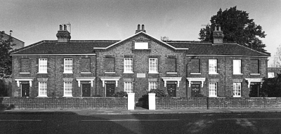 Wright's Almshouses, 346 to 356 Hertford Road
The stone tablet on the pediment above the four projecting centre bays contains the inscription 'These almshouses were erected and endowed by Mr Charles Wright of Enfield Highway for the support of six poor women'. [i]Treasures of Enfield[/i] page 35.
Keywords: almshouses