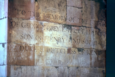 Obelisk, Trent Park. Inscription on base.
The inscription reads "TO THE MEMORY OF THE BIRTH / OF GEORGE GREY EARL OF HAROLD / SON OF HENRY AND SOPHIA / DUKE & DUTCHESS OF KENT / 1702"
  George Grey, Earl of Harold was born on 22 August 1732. He died on 3 February 1732/33. He was the son of Henry de Grey, 1st and last Duke of Kent and Lady Sophia Bentinck. He was styled as Earl of Harold. The date of 1702, possibly added when the obelisk was moved to Trent Park, is incorrect. 
The large obelisk in Trent Park was brought from Wrest Park by Sir Philip Sassoon in 1934 in order to impress the Duke and Duchess of Kent, honeymooning at the estate. A channel was carved through the forest to afford a grand view of the monument from Trent Park House. Grade II listed. - [i]Information from [url=http://www.britishlistedbuildings.co.uk/en-200608-obelisk-on-the-west-side-of-moat-wood-in]"British Listed Buildings"[/url][/i]
Keywords: memorials;Grade II listed