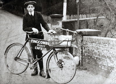 Delivery boy with bicycle from Tingcombe, draper, Baker Street
Spelling on bicycle appears to read TINCCOMBE, but the first C is probably a damaged G.
Keywords: retail;shops;bicycles