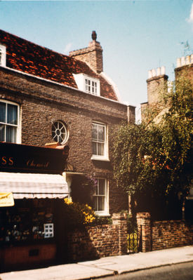 174 Baker Street (Hayward House), 1963
Adjacent to and north of the Jolly Butchers public house,  Hayward House is a 6-bedroom detached Georgian, Grade II listed, private house. The small building on the left was occupied at the time of this picture by Cross, chemists, which later became Cross and Herbert; in 2013 sale particulars it was shown as a "breakfast area" forming part of Hayward House.
Keywords: 1960s;roads and streets;shops;houses;Grade II listed