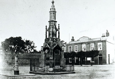 Market cross and King's Head public house, 19th century
About 1890. The old King's Head has a sign reading "KING'S HEAD / McMULLENS ... ALES ... STOUT". This was replaced by a new King's Head in 1899.
Keywords: 19th century;inns;market crosses;pubs;demolished buildings;pumps;market places