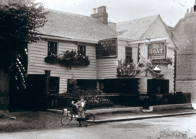 Goat public house, Forty Hill
Weatherboarded Goat Inn. Sign reads "The GOAT / H.L.[?] HUMBERSTONE". Outside is a boy leaning on a bicycle.
Keywords: pubs;inns;bicycles;weatherboarding;windowboxes